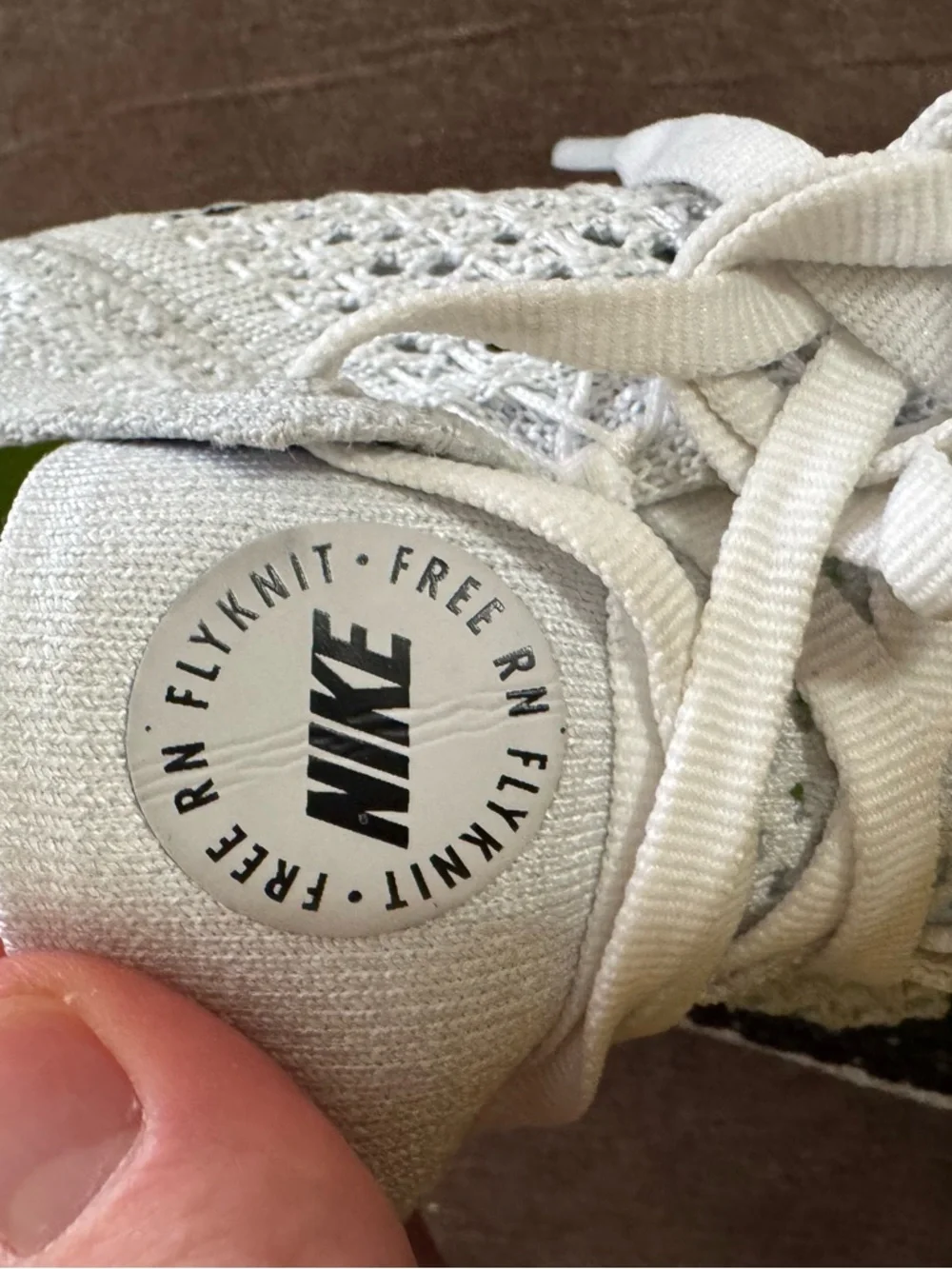 Nike Women's White Flyknit Running Sneakers with Black Swoosh - Picture 5 of 7